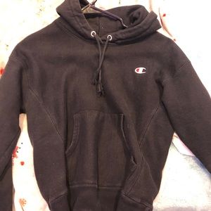 A black Champion hoodie. It’s worn once,